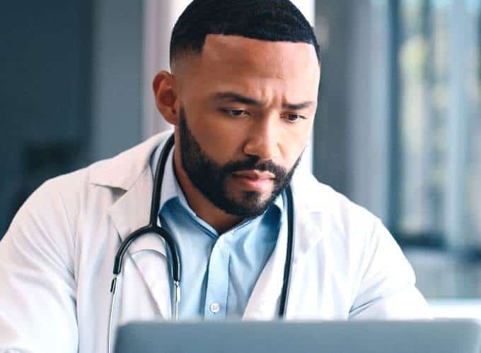 blog-article-image doctor and laptop for hospital planning
